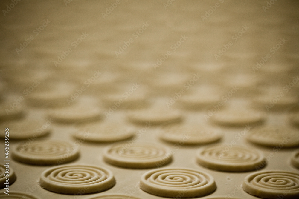 CEREAL AND COOKIE FACTORY. CLOSE UP AND DETAIL OOF PRODUCTION LINE. High quality photo CEREAL AND COOKIE FACTORY. CLOSE UP AND DETAIL OOF PRODUCTION LINE. High quality photo