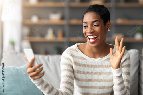 Joyful African American Lady Making Video Call On Smartphone At Home