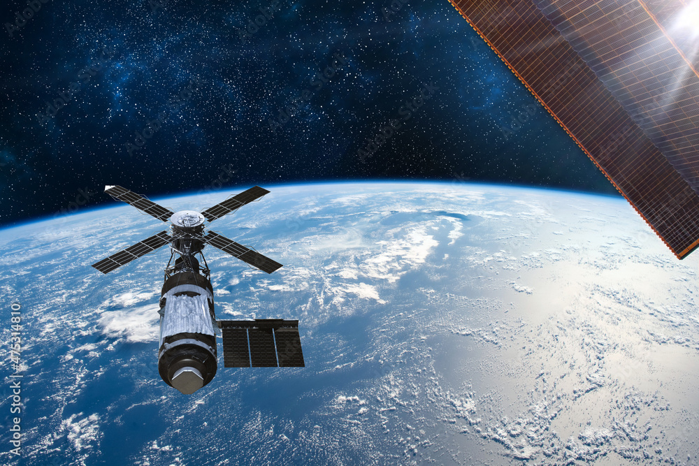 Obraz premium Cargo space craft Earth planet.Dark background. Sci-fi wallpaper.Space Station Orbiting Earth.Space ship.Space art wallpaper.Solar Observatory.Elements of this image furnished by NASA.3D illustration