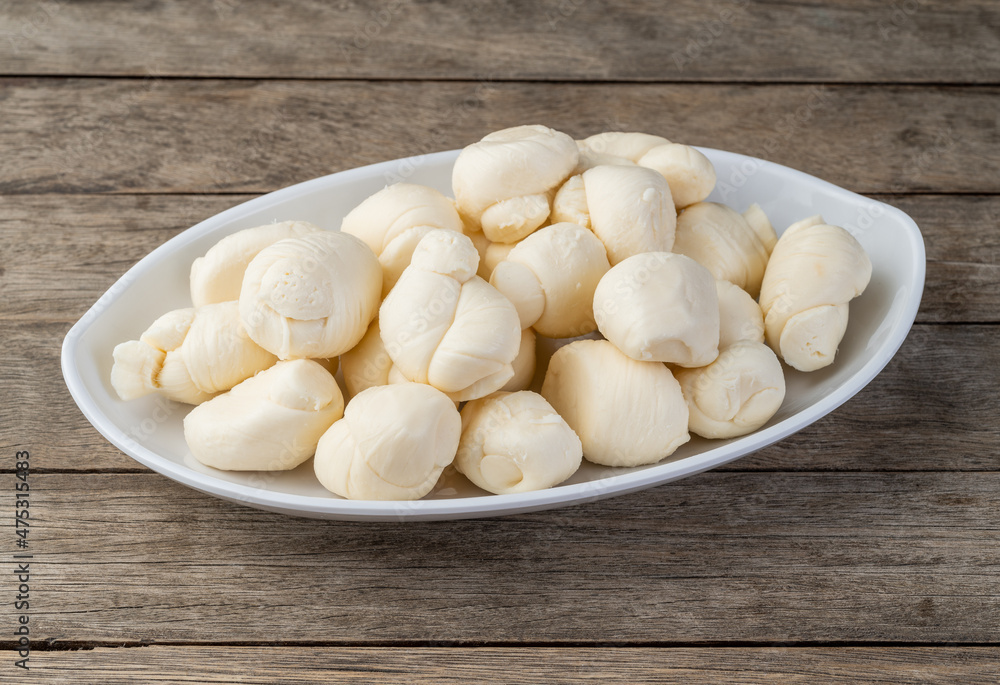 Nozinho or Knot mozzarella, typical brazilian artisanal fresh white cheese Nozinho or Knot mozzarella, typical brazilian artisanal fresh white cheese