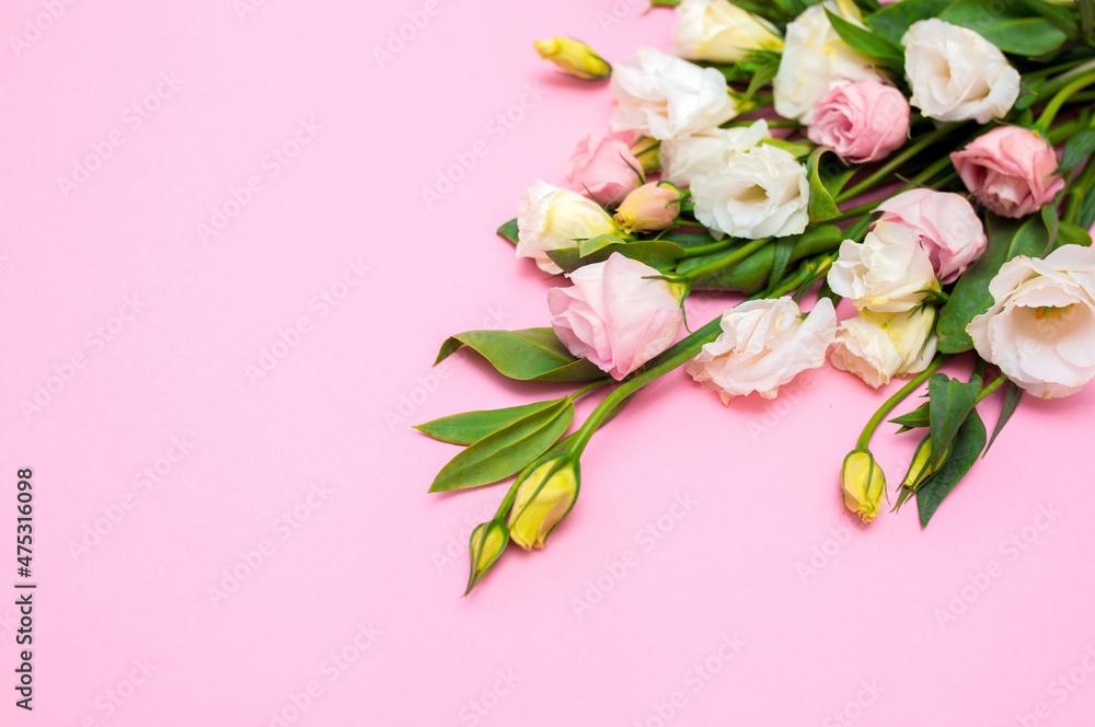 Festive bouquet of flowers for the beloved on a pink background. The concept of love congratulations on the wedding, March 8, Valentine's Day, Christmas and birthday. Copy space. Festive bouquet of flowers for the beloved on a pink background. The concept of love congratulations on the wedding, March 8, Valentine's Day, Christmas and birthday. Copy space.