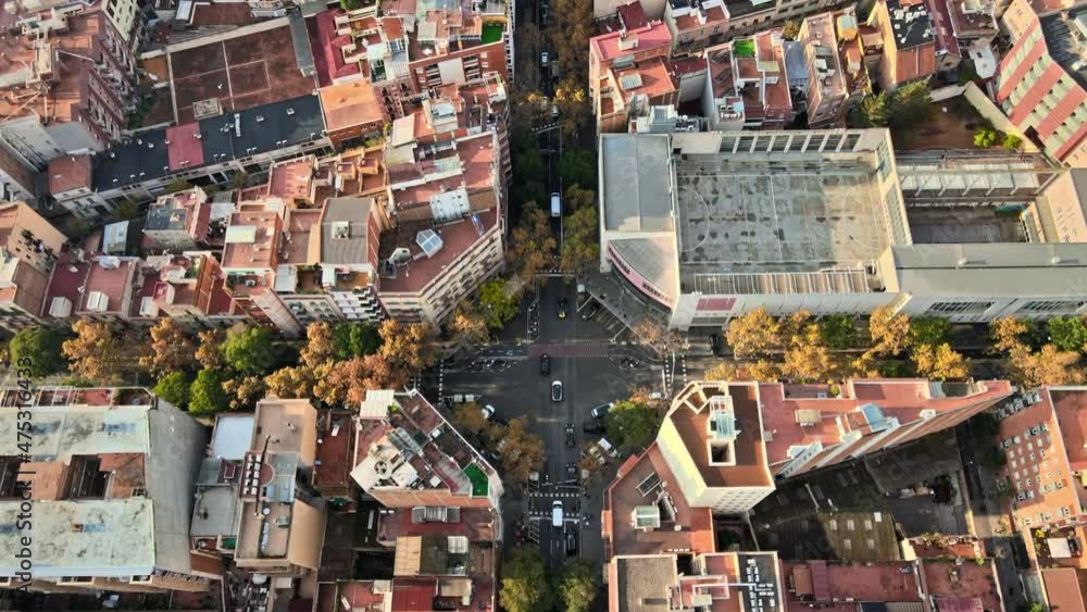 Aerial drone view of Barcelona, Spain. Blocks with multiple residential buildings and Sagrada Familia, roads with cars Aerial drone view of Barcelona, Spain. Blocks with multiple residential buildings and Sagrada Familia, roads with cars
