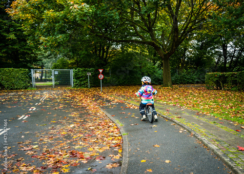 Photography young child on a balance bike in the copenhagen traffic playground