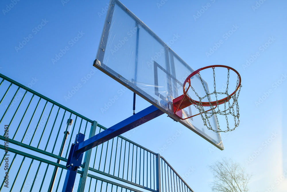 basketball shield and basket on a blue sky background