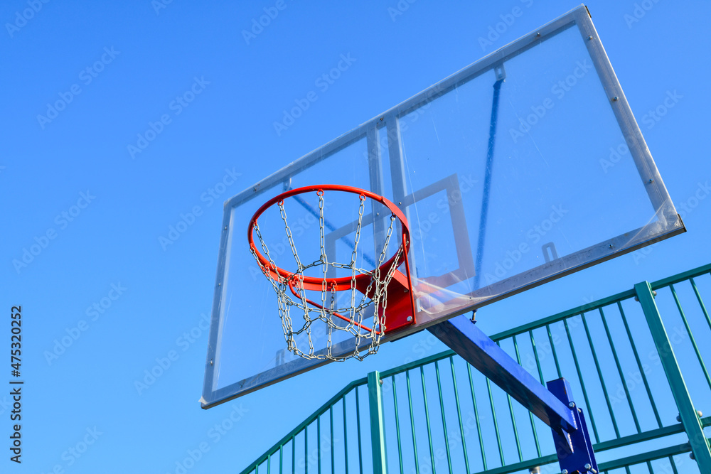 basketball shield and basket on a blue sky background