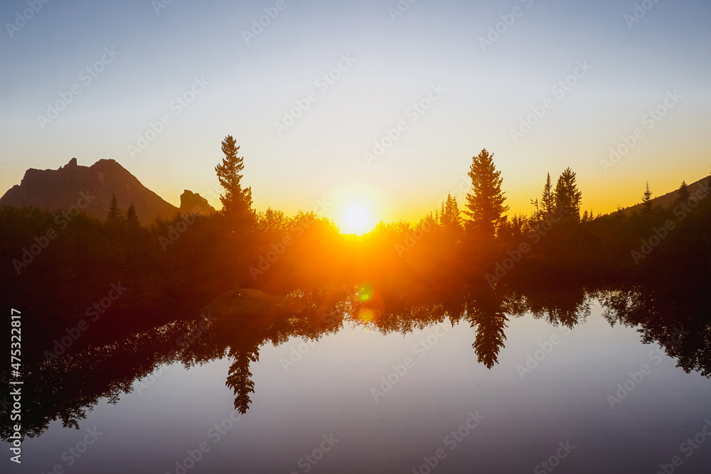 Beautiful sunset over a mountain lake in the Ergaki Nature Reserve