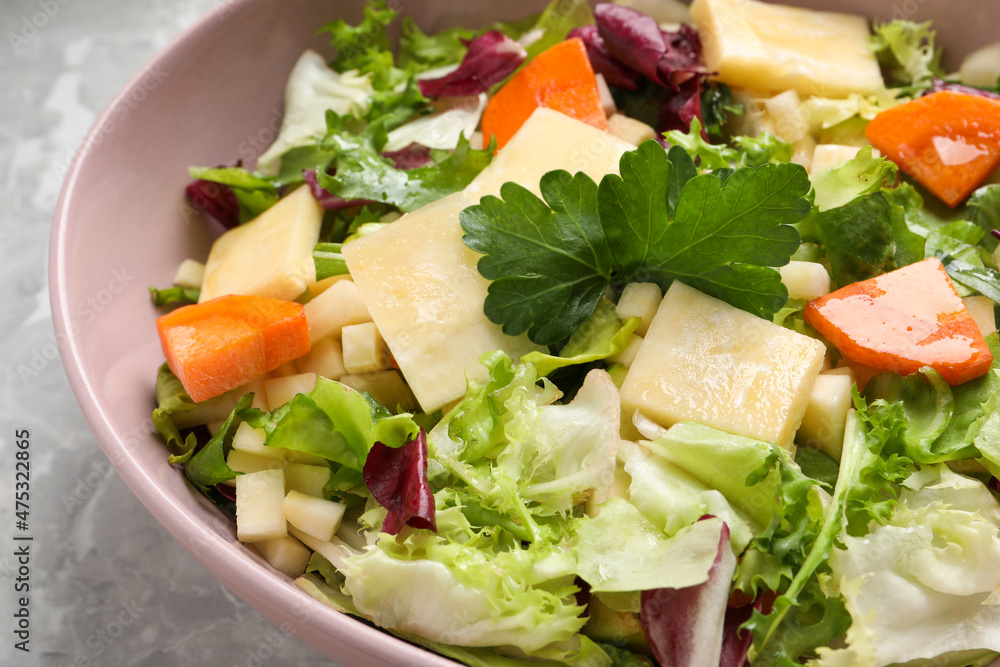 Delicious turnip salad served on light grey marble table, closeup Delicious turnip salad served on light grey marble table, closeup
