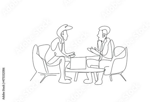 Two people sitting opposite each other talking. business world two people at the meeting