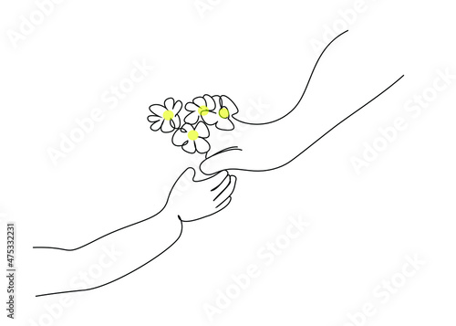 boy giving flowers to his mother for mother's day.