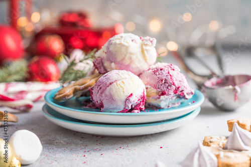 Candy Cane Ice Cream scoops  in plate and Christmas decor. New Year's desserts