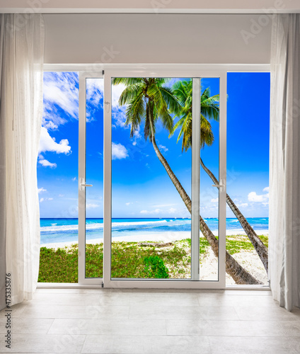 large glass door overlooking the beach