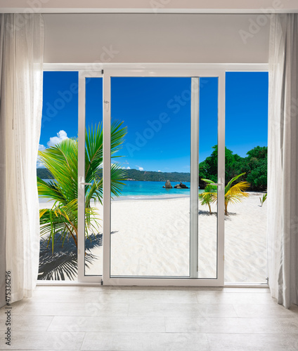 large glass door overlooking the beach