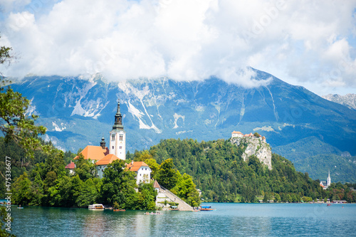 St. Mary church on the small island on the lake Bled against the mountain background in Slovenia