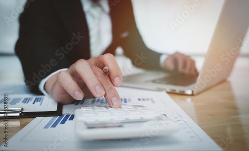 Close uo of Businessman working at office with documents on his desk, doing planning analyzing the financial report, business plan investment, finance analysis concept