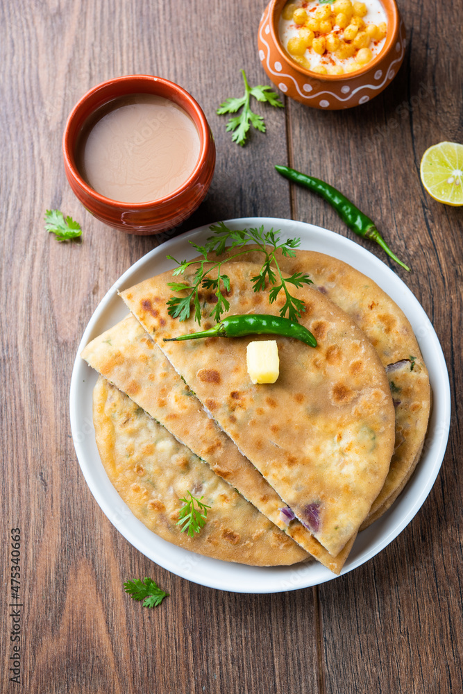 Paneer paratha is a popular North Indian flatbread made with whole wheat flour dough and stuffed with savory, spiced, grated paneer Paneer paratha is a popular North Indian flatbread made with whole wheat flour dough and stuffed with savory, spiced, grated paneer