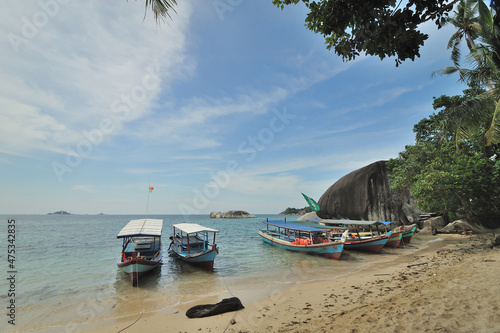 Traditional tourist boats moored at the beach in Belitung Island  Indonesia.