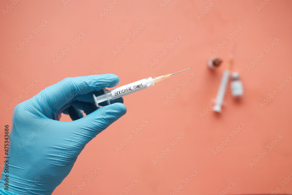 booster shot test on syringe close up booster shot test on syringe close up