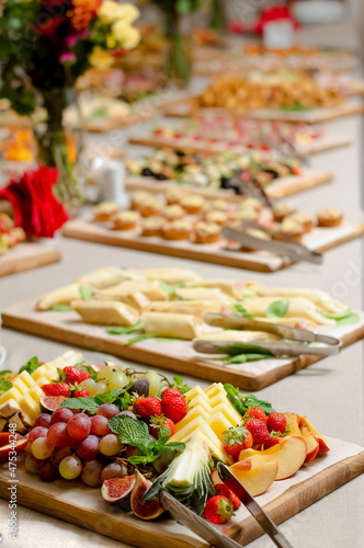 Blurred image of a festive buffet table with different food.