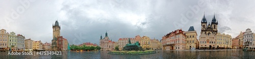 Panorama view of Old Town Square in Prague, Czech Republic with landmarks of Old Town Hall, Astronomical Clock Tower, Gothic Church of Our Lady before Tyn, Jan Hus Memorial & the St. Nicholas Church