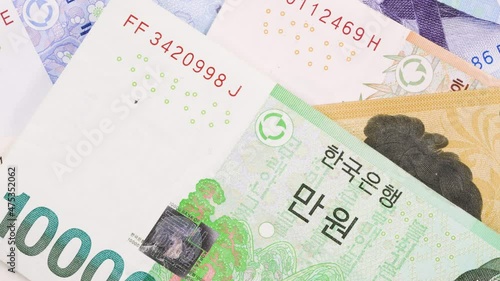 korean currency bill. there is 1000, 10000, 5000, 50000 photo