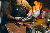 close up man working with wood in his workshop