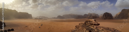 Valokuva Trucks entering bedouin tent camp at Wadi Rum Desert in Jordan.