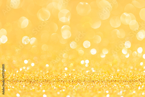sparkles of yellow glitter abstract background. Copy space