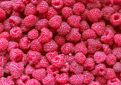 Juicy ripe raspberries, top view. Raspberry background