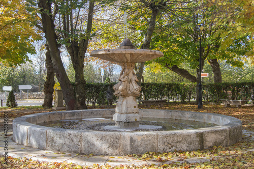 Churrigueresque style ornamental fountain in a square in the historic-artistic complex of the town of Nuevo Baztan, province of Madrid. Spain photo