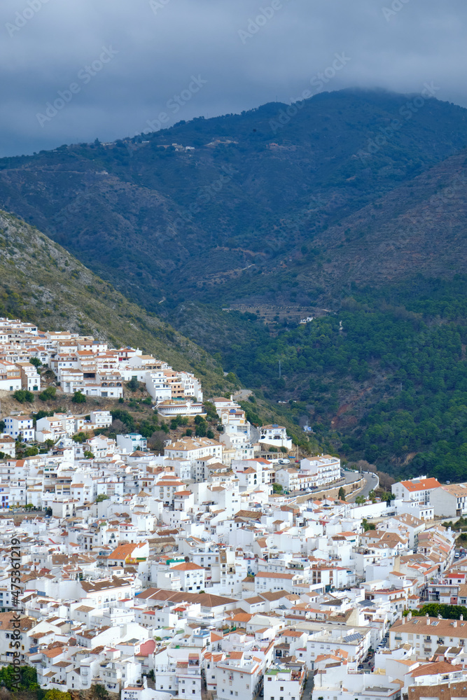 Ojén Spain urban view of the city with beautiful green nature around on a cloudy day, small Spanish old town