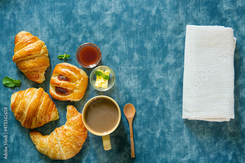 Breakfast with coffee and croissants, selective focus