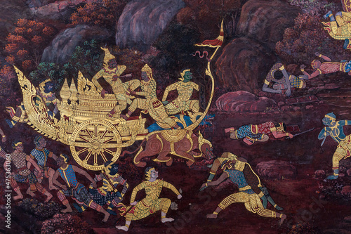 Gold color of old mural is the story of Ramakian ,Ancient fresco at Wat Phra Kaew temple in Bangkok, Thailand ,Generally in Thailand, any kinds of art decorated in Buddhist church, temple pavilion,