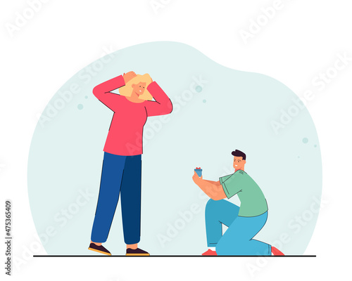 Man on one knee with gift box and confused woman. Happy boyfriend proposing to his partner flat vector illustration. Love, relationship concept for banner, website design or landing web page
