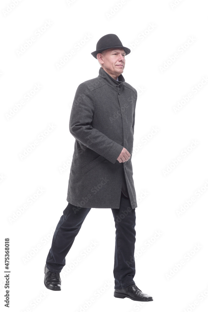 intelligent man in an autumn coat striding forward. intelligent man in an autumn coat striding forward.