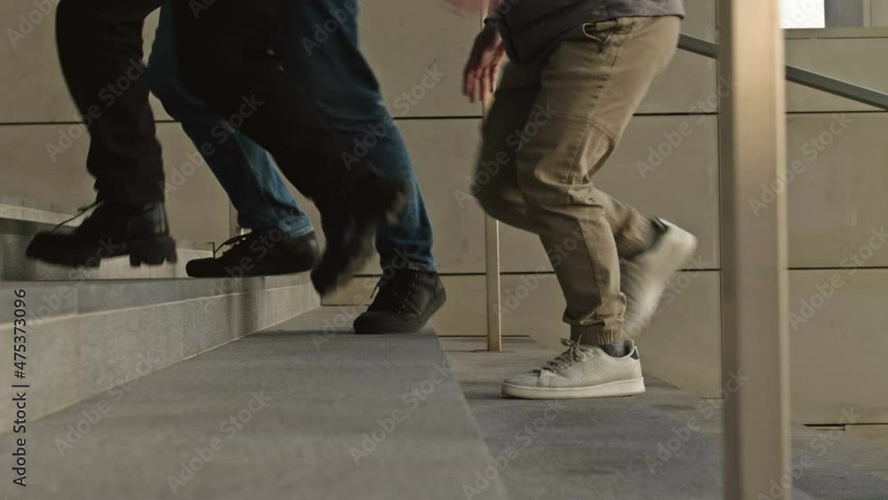 Legs of different people going down the stairs of an underpass or subway. Legs of different people going down the stairs of an underpass or subway.