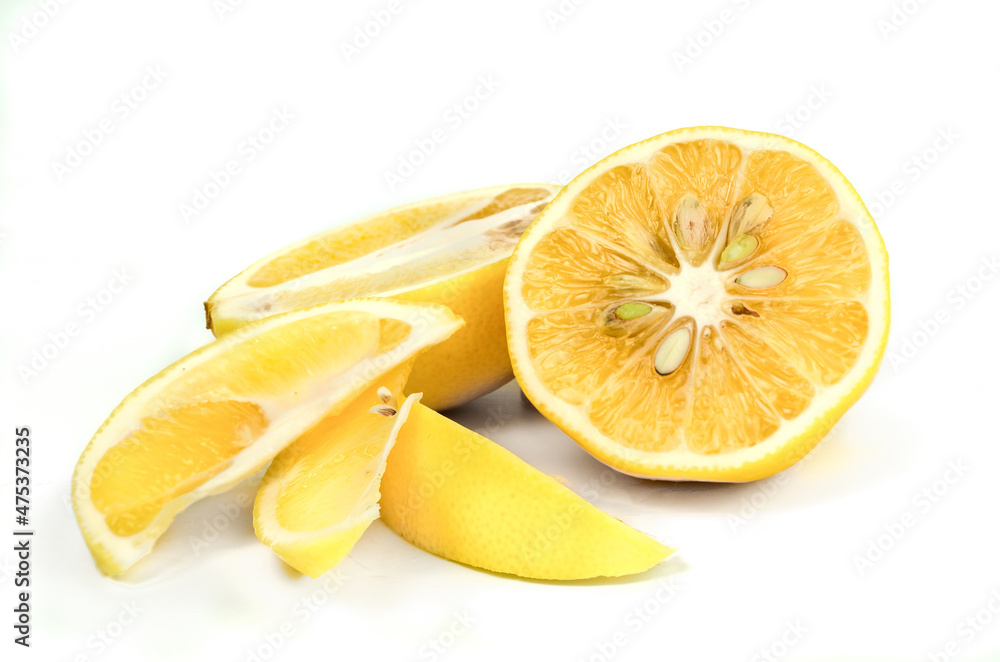 Fresh organic lemons with leaf over white background
