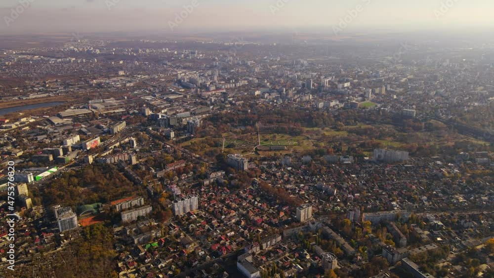 Aerial drone view of Chisinau in autumn, Moldova. Yellowed vegetation, multiple buildings Aerial drone view of Chisinau in autumn, Moldova. Yellowed vegetation, multiple buildings
