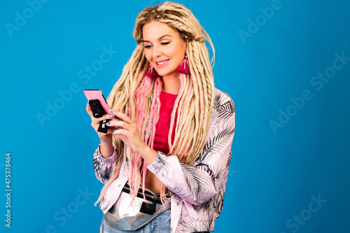 Funny studio portrait of hipster woman with dreads