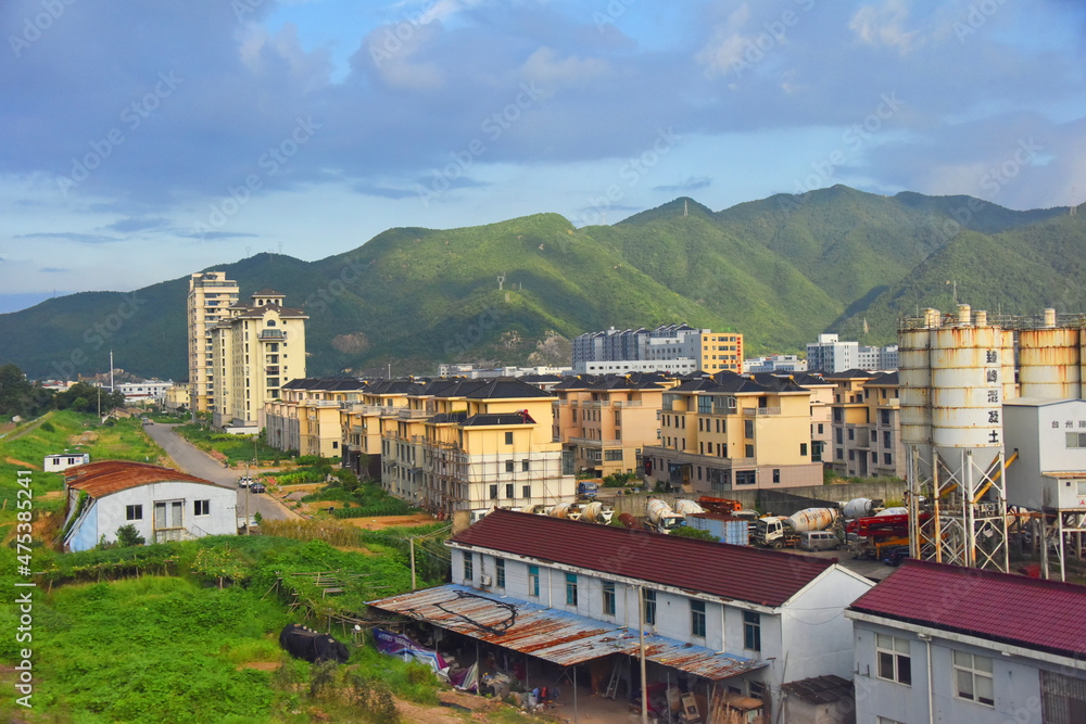 City with mountain at background, Zhejiang Province, China