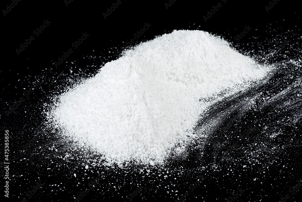 Pile of white snow isolated on a black background. White snow at night. Pile of white snow isolated on a black background. White snow at night.