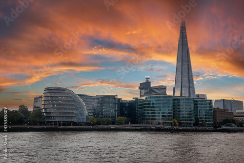 Panoramic view of the London river Thames during magical sunset and Shard skyscraper in the background.