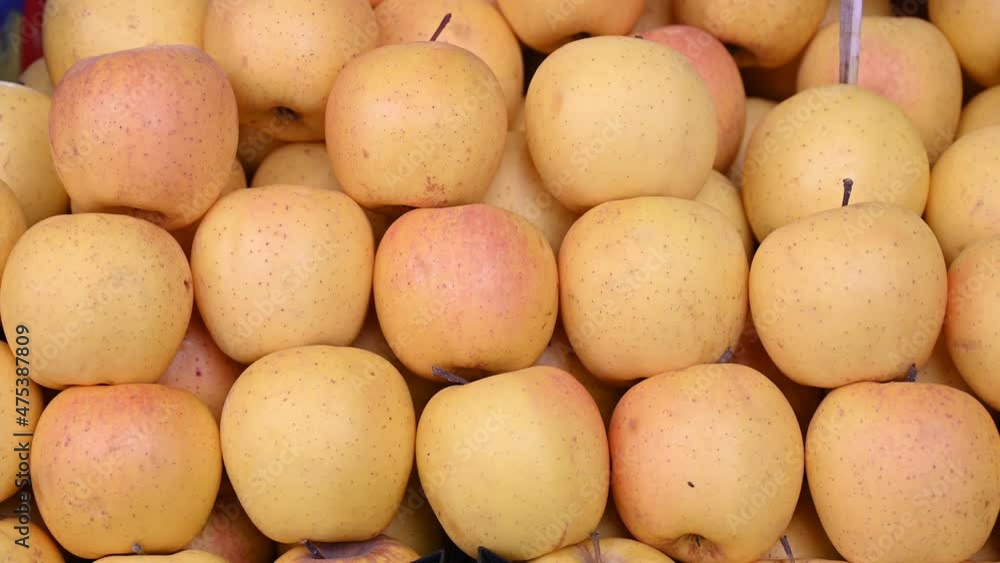 Fresh apples for sale at vegetable market, close up. Boxes full of raw apples in shop. Organic apple at the greengrocer's stall. Fruit. Fresh apples for sale at vegetable market, close up. Boxes full of raw apples in shop. Organic apple at the greengrocer's stall. Fruit.