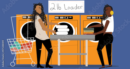 Gay couple folding laundry at the laundromat