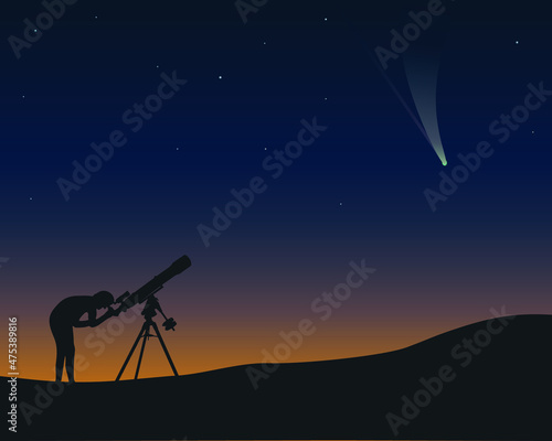 A man at night looks through a telescope refractor at a comet 