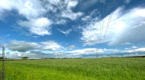 Extensive landscape, with green fields, and distant farm buildings, near the, Long Causeway Road, Denholme, UK photo