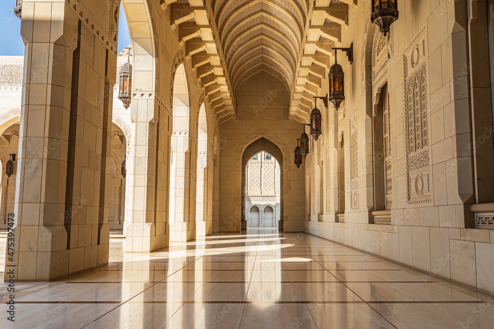 Middle East, Arabian Peninsula, Oman, Muscat. Exterior corridor of Sultan Qaboos Grand Mosque in Muscat. (Editorial Use Only)
