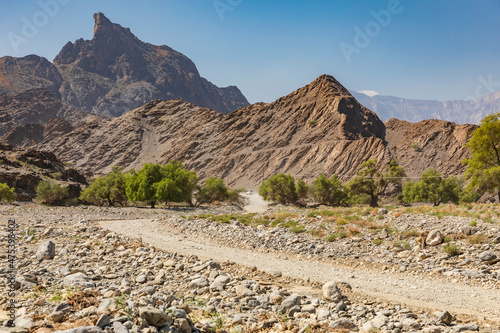 Middle East, Arabian Peninsula, Oman, Al Batinah South, Rustaq. A wadi in the desert mountains of Oman. photo