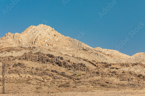 Middle East, Arabian Peninsula, Ash Sharqiyah South, Jalan Bani Buali. Folded sedimentary rock in a mountain in Oman.