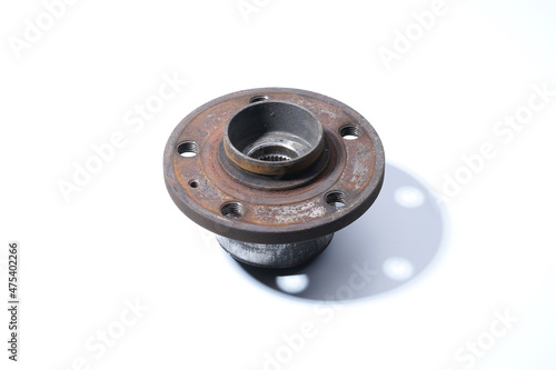 The bottom of the wheel hub on a white background. Old brake disc holes. Wheel bearing.