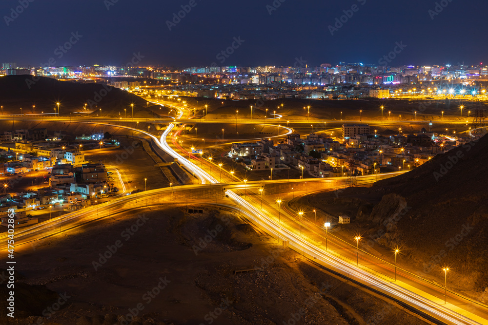 Middle East, Arabian Peninsula, Oman, Muscat, Bawshar. Night view of roads in Muscat.